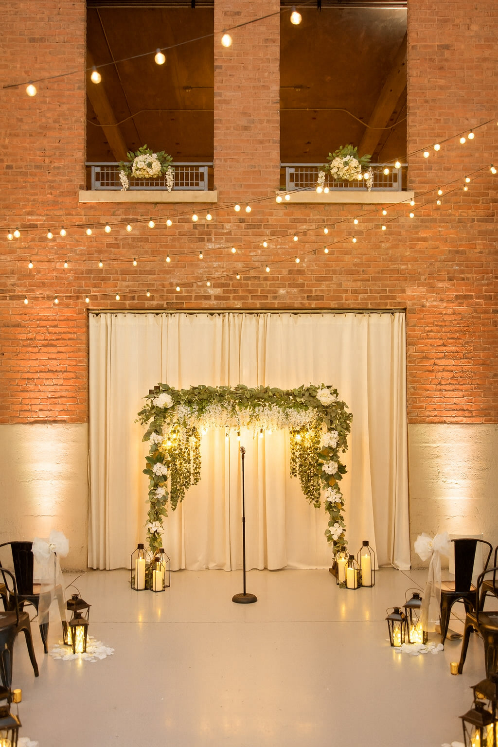 Wooden Arch with White Wisteria and Edison Lights